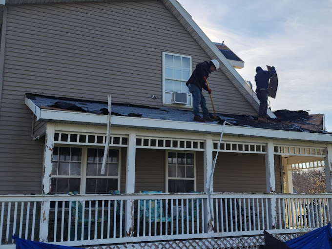 True Built Home Pros crew tearing off an old roof